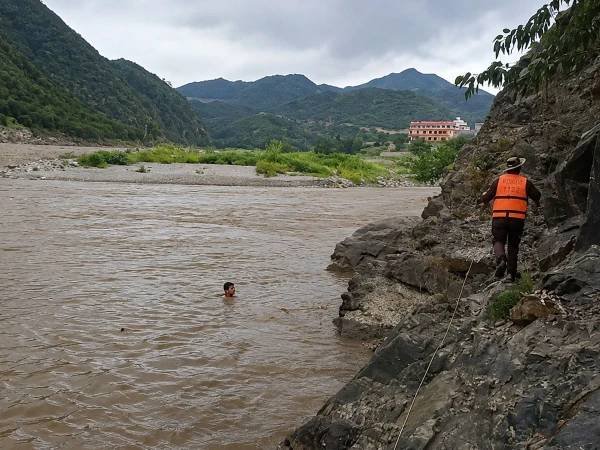 Girl and Rescuer Swept Away in Panjkora River, Search Operation Underway